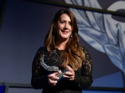 'Cada año desde mi casa, cuando veía a un autor que subía aquí, soñaba con ser yo', dijo Redondo tras recibir el premio. AFP / J. Lago