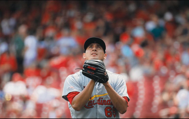 Giovanny Gallegos entró de relevo y recetó cuatro ponches consecutivos para lograr la victoria. AP / J. Minchillo