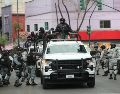 Integrantes de la Guardia Nacional resguardan el lugar al que trasladaron el cuerpo de Nemesio Oseguera Cervantes, alias "El Mencho". EFE/M. Guzmán