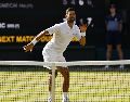 El jugador balcánico logró su victoria número 407 en un Grand Slam y ampliar su récord histórico de más victorias en partidos individuales de esta categoría. EFE / T. Akmen