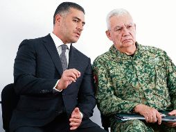 Los dos integrantes del gabinete se reunieron en Morelia. AFP