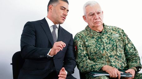 Los dos integrantes del gabinete se reunieron en Morelia. AFP