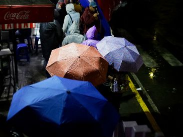 El SMN advierte sobre lluvias torrenciales, granizo y posibles inundaciones en varios estados de México por el monzón y la onda tropical 39. AFP/ARCHIVO